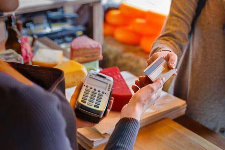 Customer paying by card at a store checkout