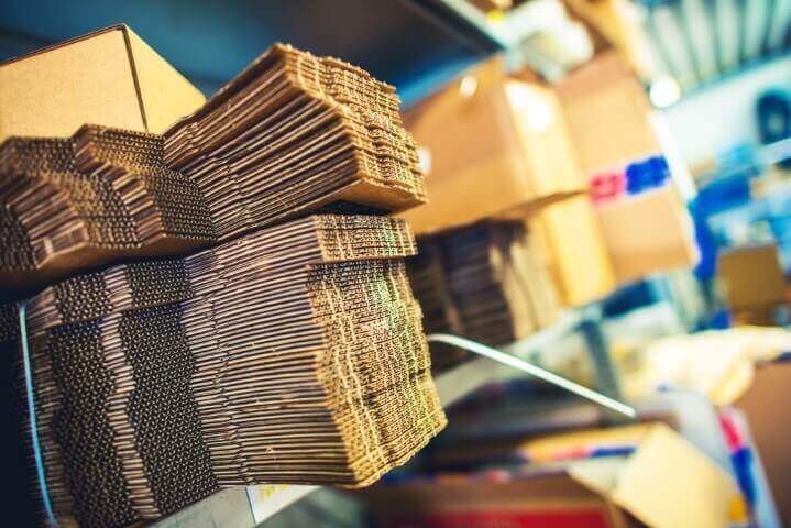 Stacked cardboard boxes in a shipping department